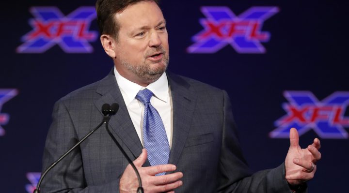 coach bob stoops speaking at a press conference for the xfl